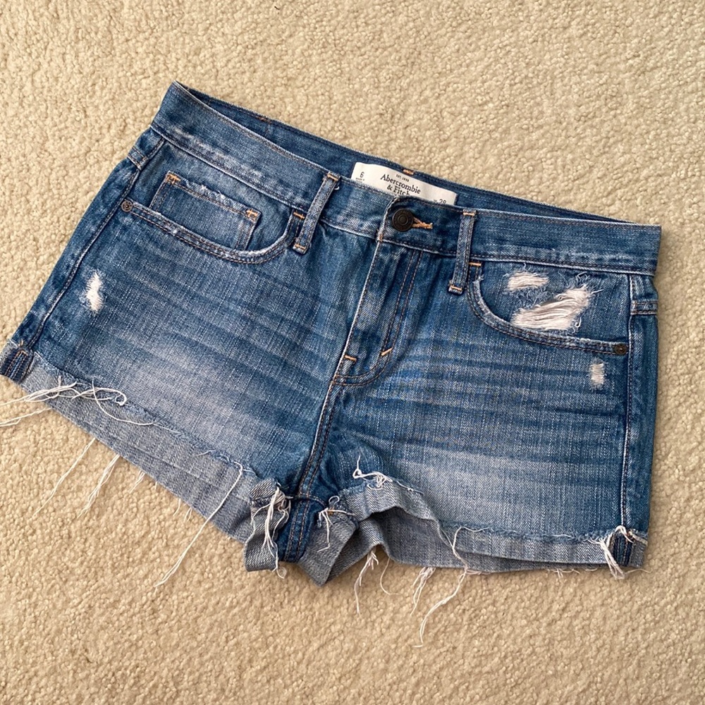 High rise distressed denim shorts